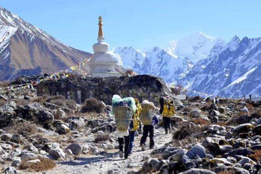 Langtang valley porters carrying stuff on their back